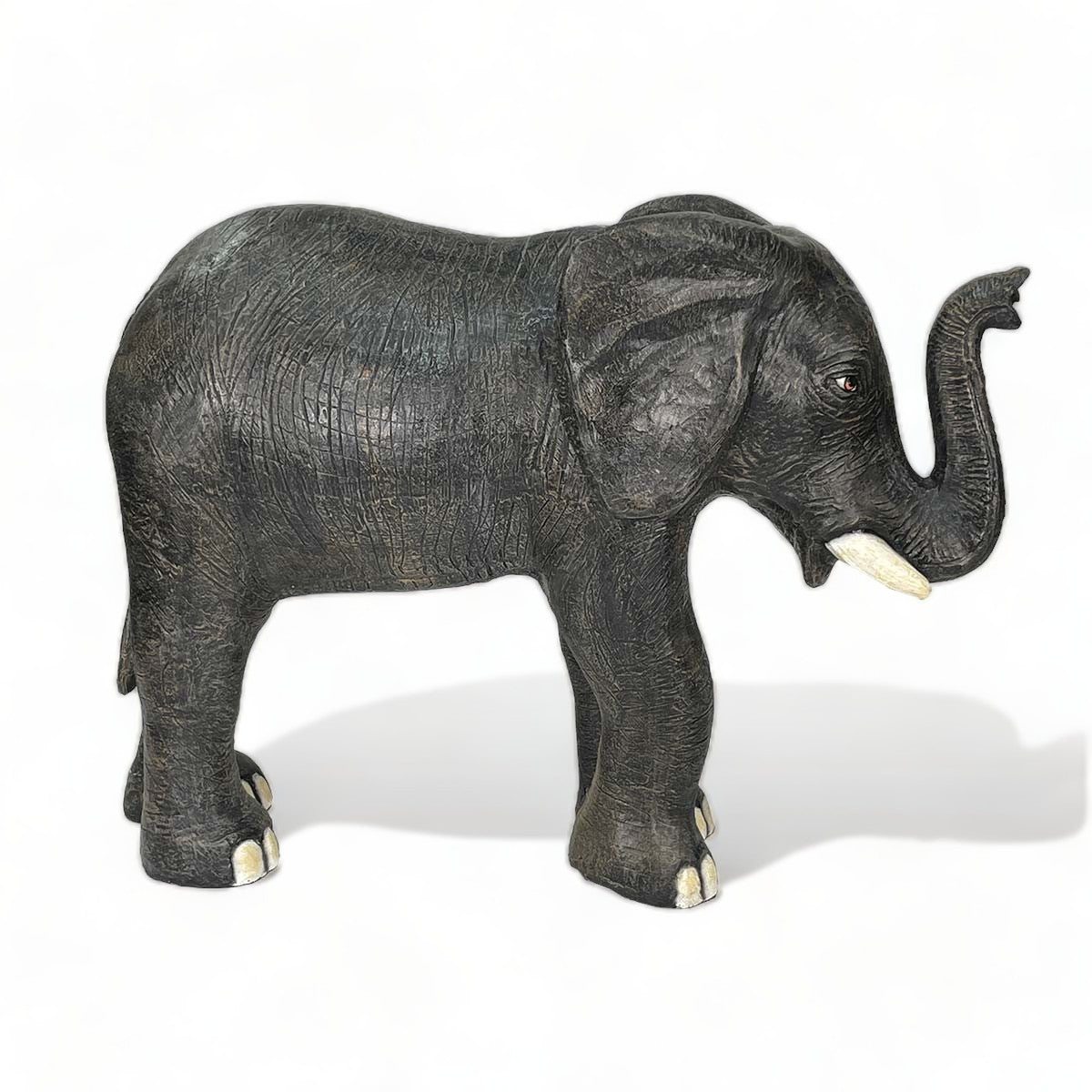 Large elephant fountain sculpture with water flowing from trunk