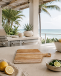 Bali teak cutting board in a shaded Miami outdoor kitchen