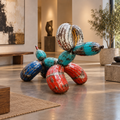 Recycled metal barrel Balloon Dog sculpture in a gallery interior