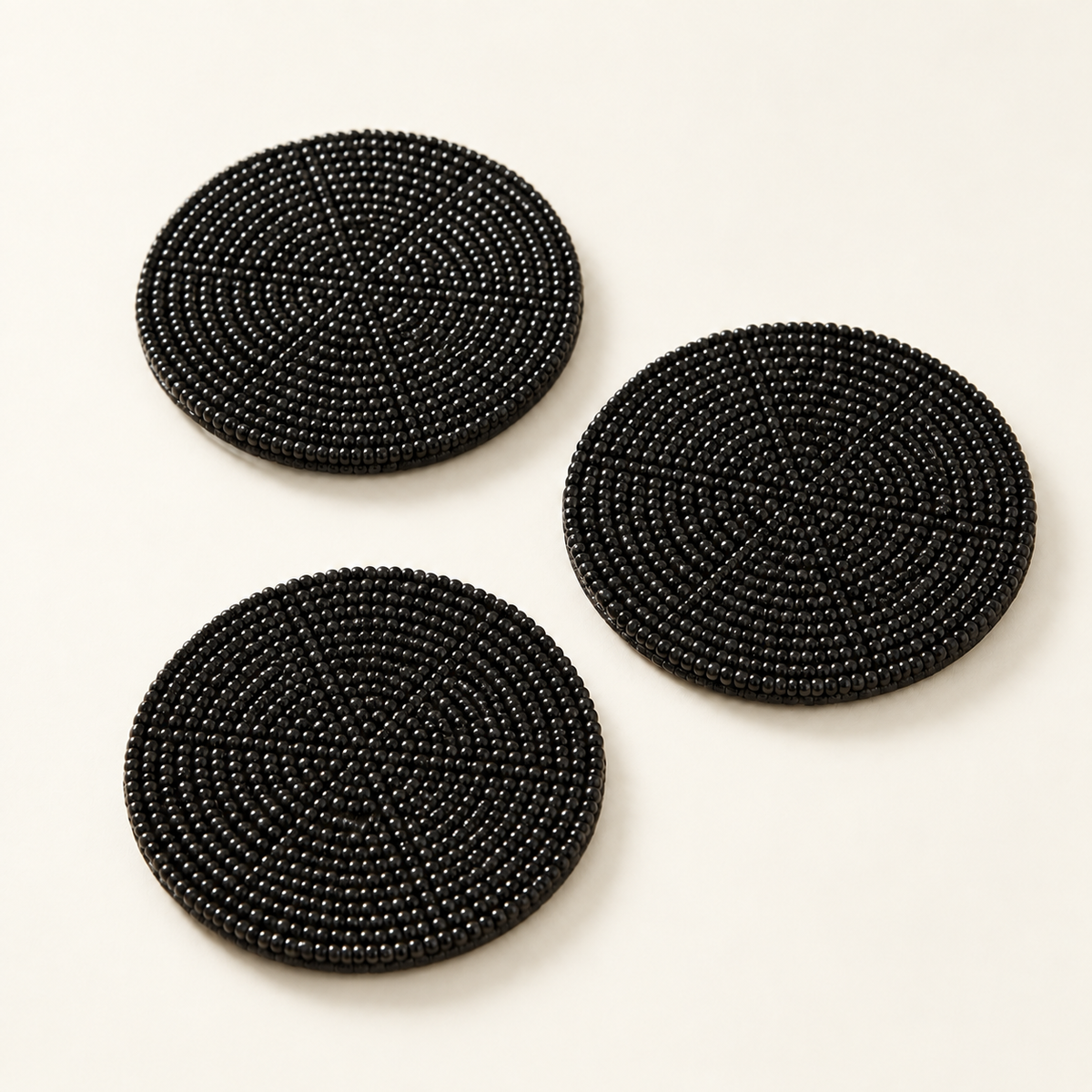 Black hand-beaded coaster, top catalog view