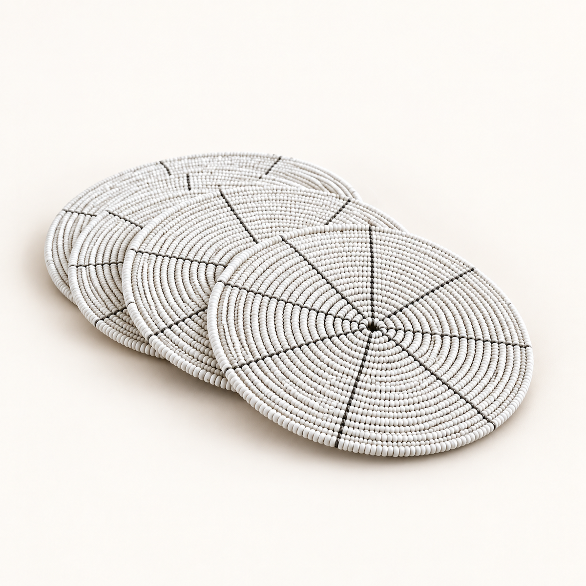 White hand-beaded coaster, angled catalog view