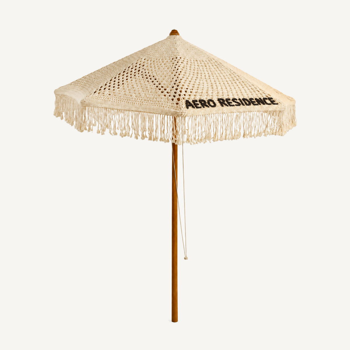 Bespoke macrame signature umbrella with handmade lettering, left angle