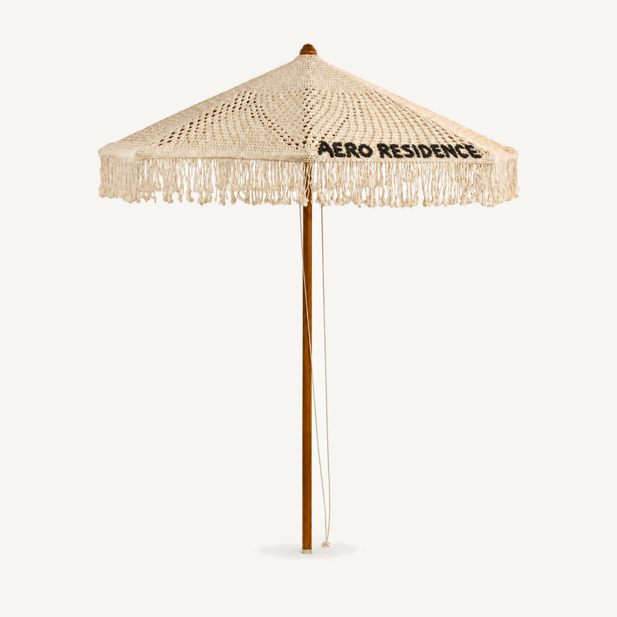 Bespoke macrame signature umbrella with hand-crocheted custom lettering, front view