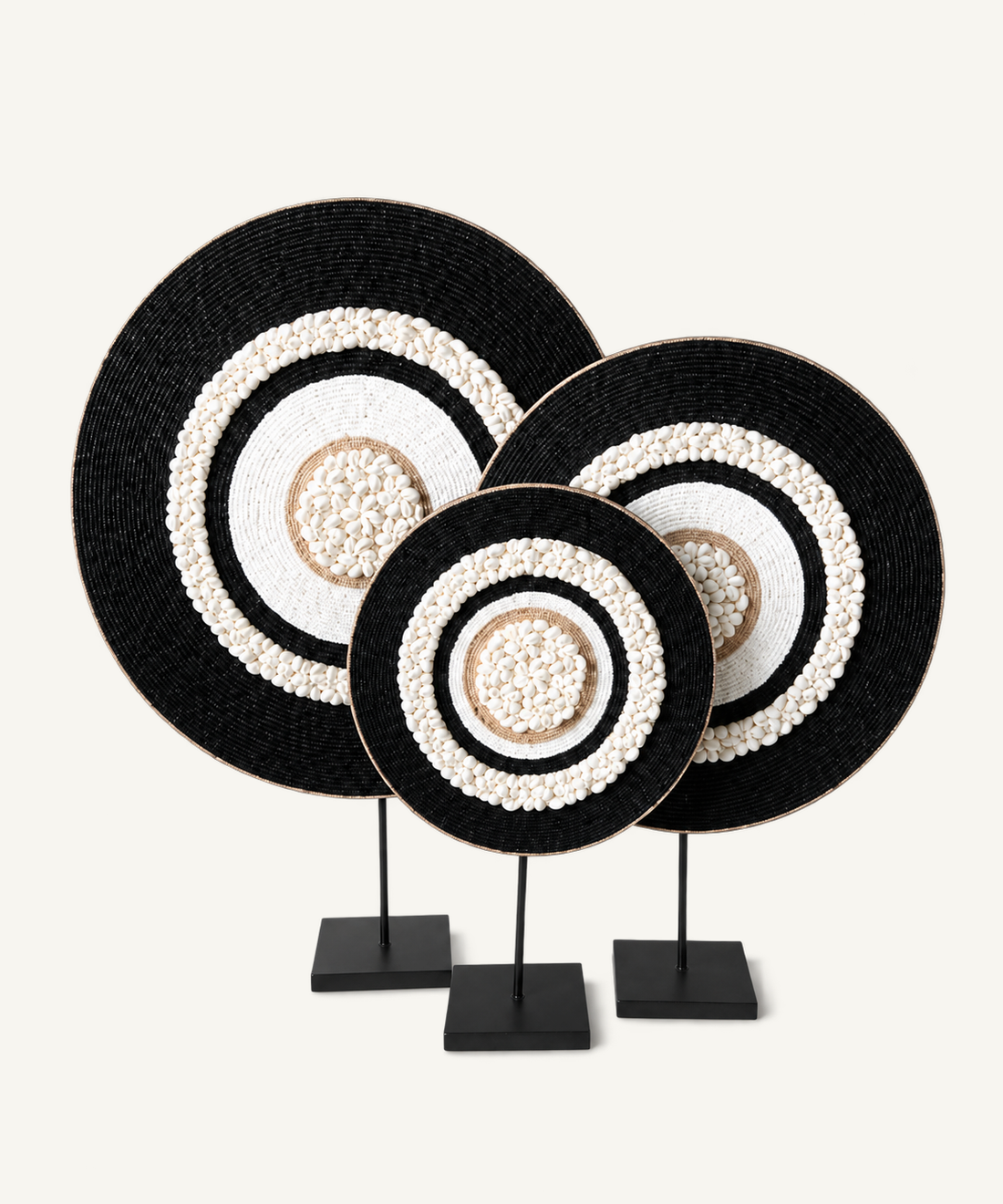 Black concentric shell sculptures in S, M and L on included metal stands