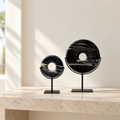 Black natural stone disks styled in a refined Miami interior
