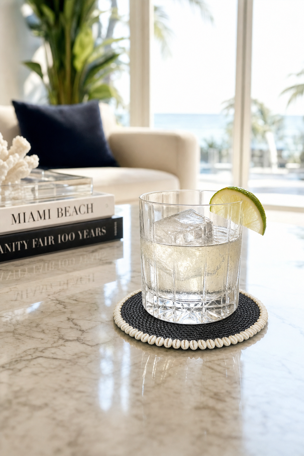 Handwoven Rattan & Cowrie Shell Coaster in Black, styled setting