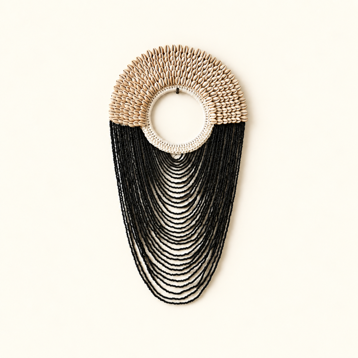 Black Shell Fringe decorative necklace, full product centered on warm cream background