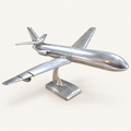 Boeing polished aluminum aircraft sculpture, front three-quarter view