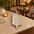 Botanical teak and white resin leaf decorative tray in a luxury Miami restaurant
