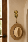 Bronze pineapple wall hook in a refined entryway