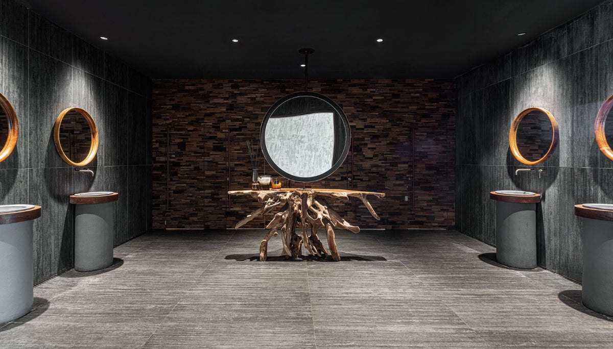 Kai washroom with sculptural root console and custom wood details
