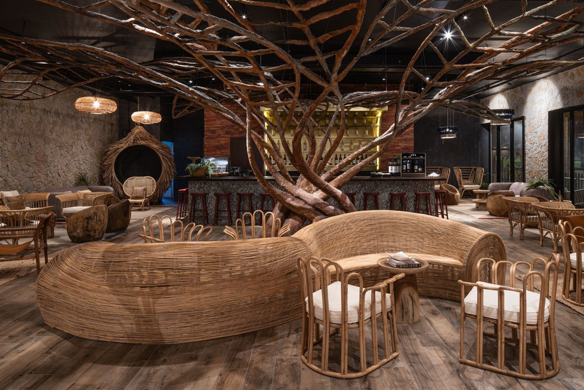 Kai interior with sculptural tree installation and handcrafted rattan furniture