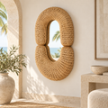 Double Loop Rattan Mirror styled in a warm neutral interior