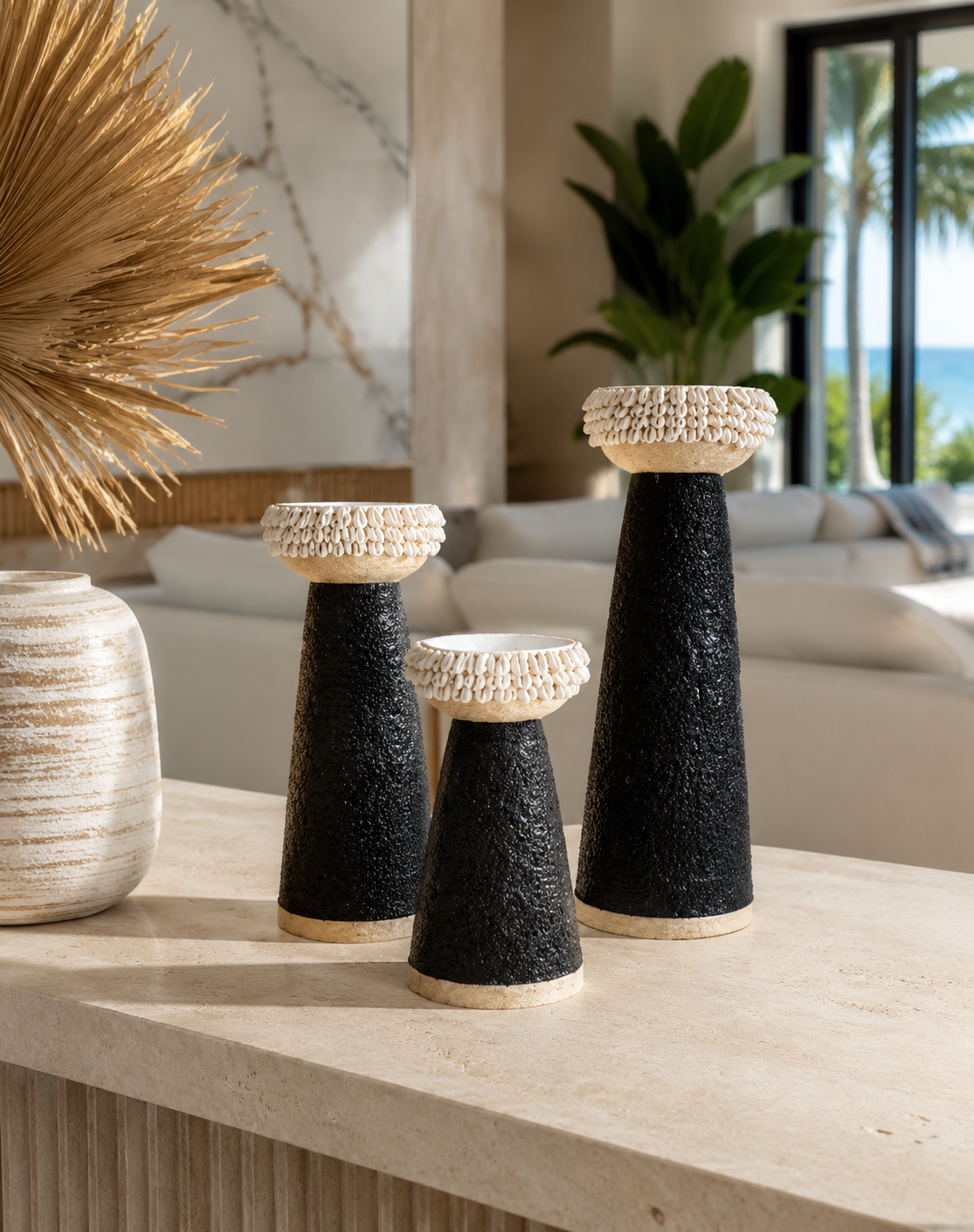 Black shell-trim candle holders styled in a Miami interior