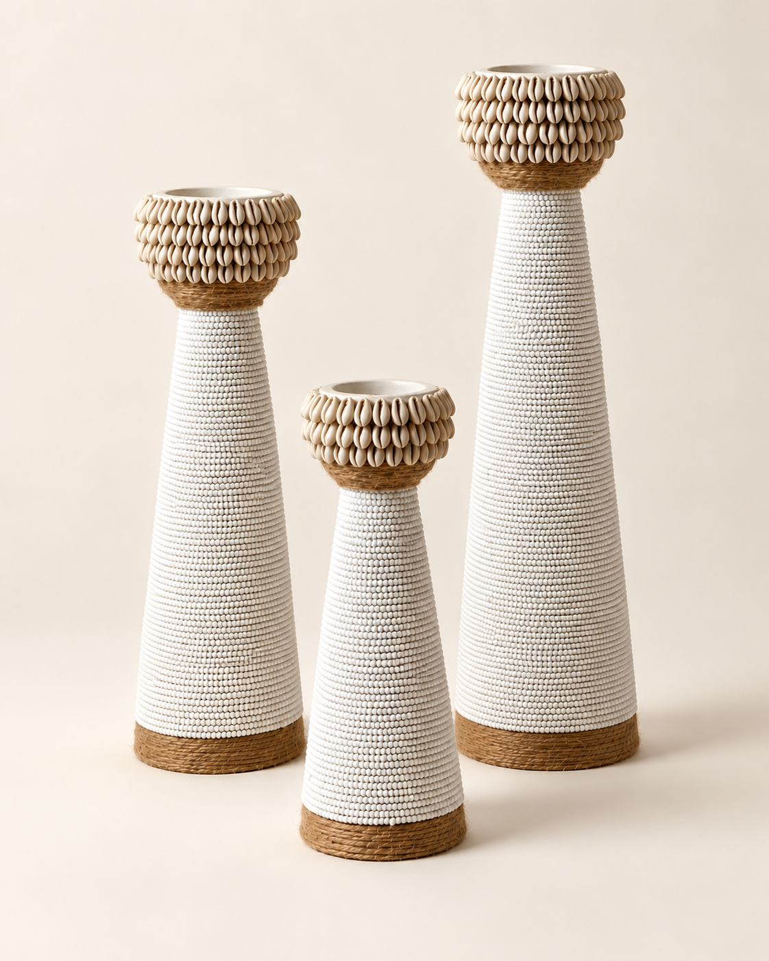 White shell-trim candle holders in three sizes, angled view