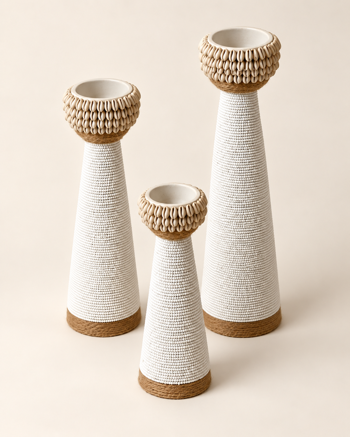 White shell-trim candle holders in three sizes, detail view