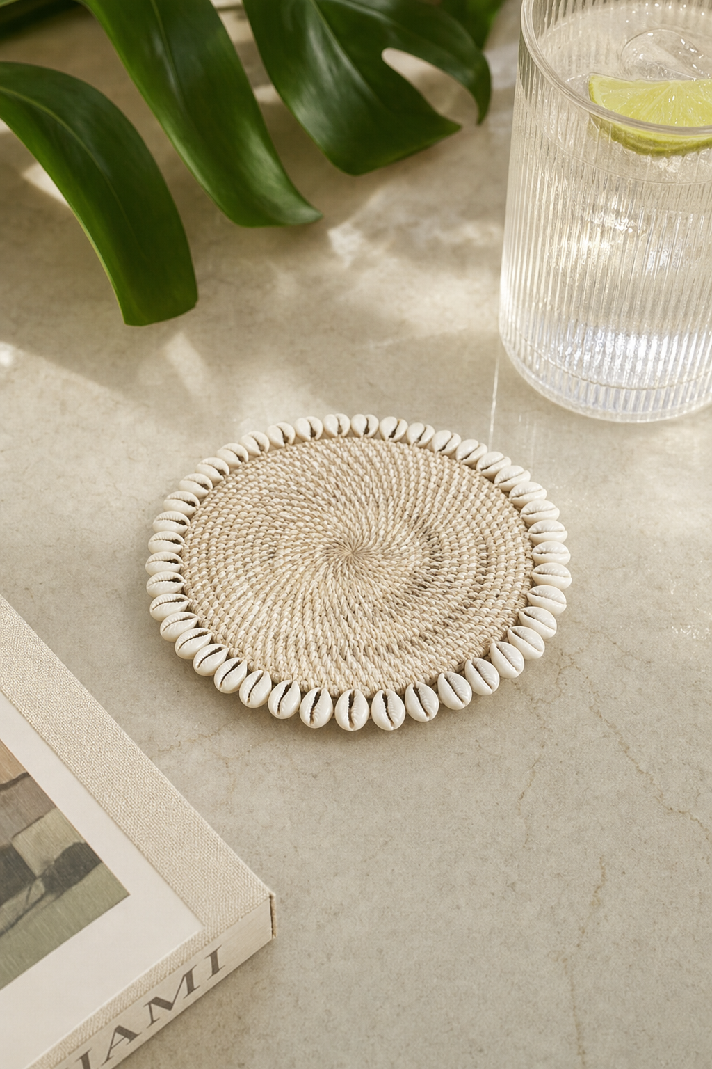 Handwoven Rattan & Cowrie Shell Coaster in Ivory, styled setting