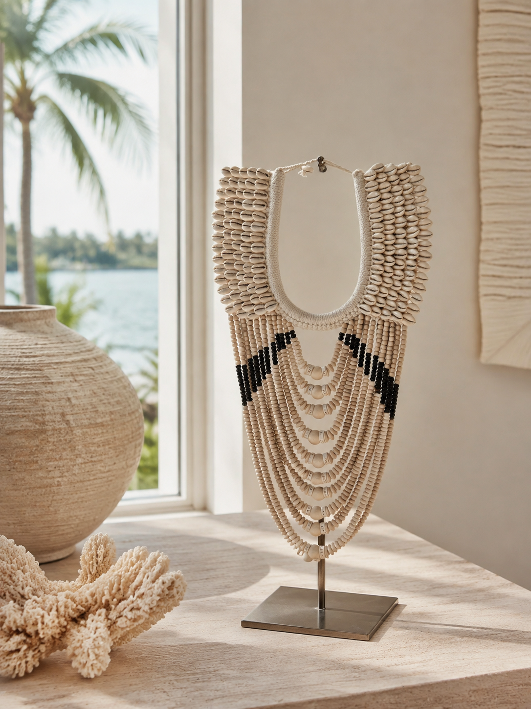 Layered Cowrie decorative shell necklace — Layered Cowrie Shell Necklace on Metal Stand lifestyle image