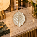 White Serrated Leaf decorative tray in a luxury hotel lobby