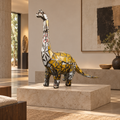Recycled metal barrel Long-Neck Dinosaur sculpture in a gallery interior