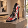 Recycled metal barrel High Heel sculpture in a gallery interior