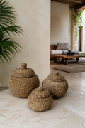 Natural hand-beaded lidded baskets in a luxury interior
