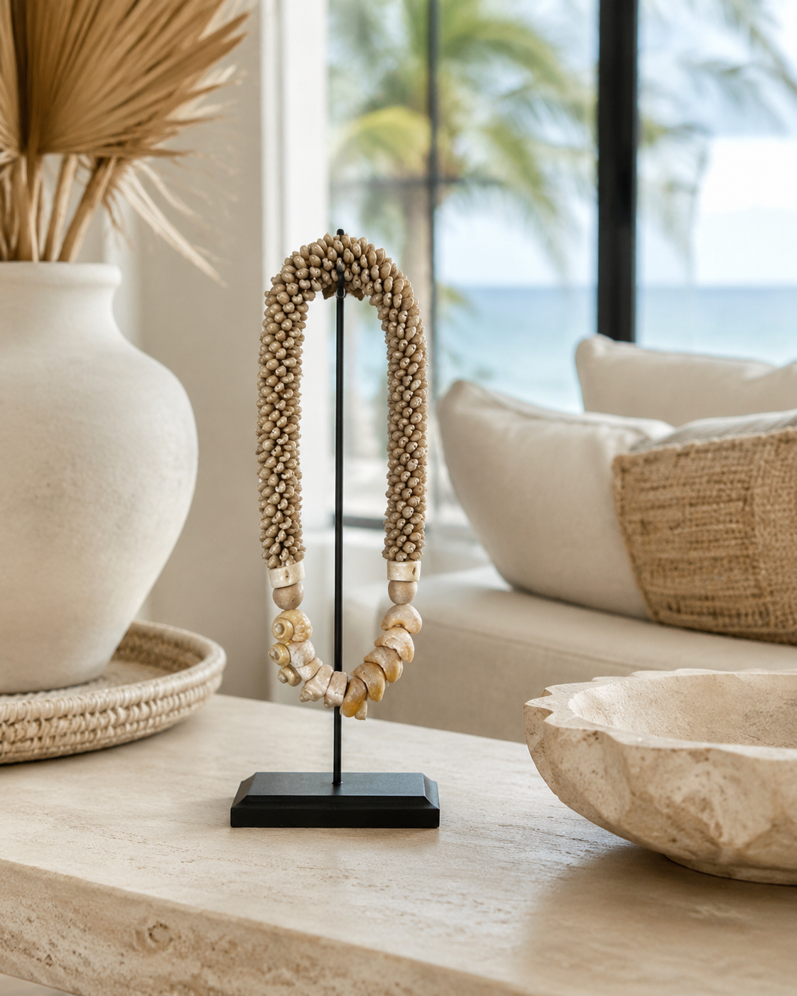Natural Cowrie Statement decorative shell necklace — Natural Cowrie Statement Necklace on Metal Stand lifestyle image