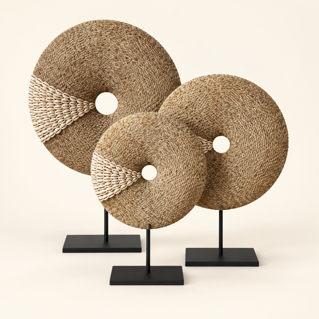 Natural Shell donut sculptures in S, M and L on included black metal stands