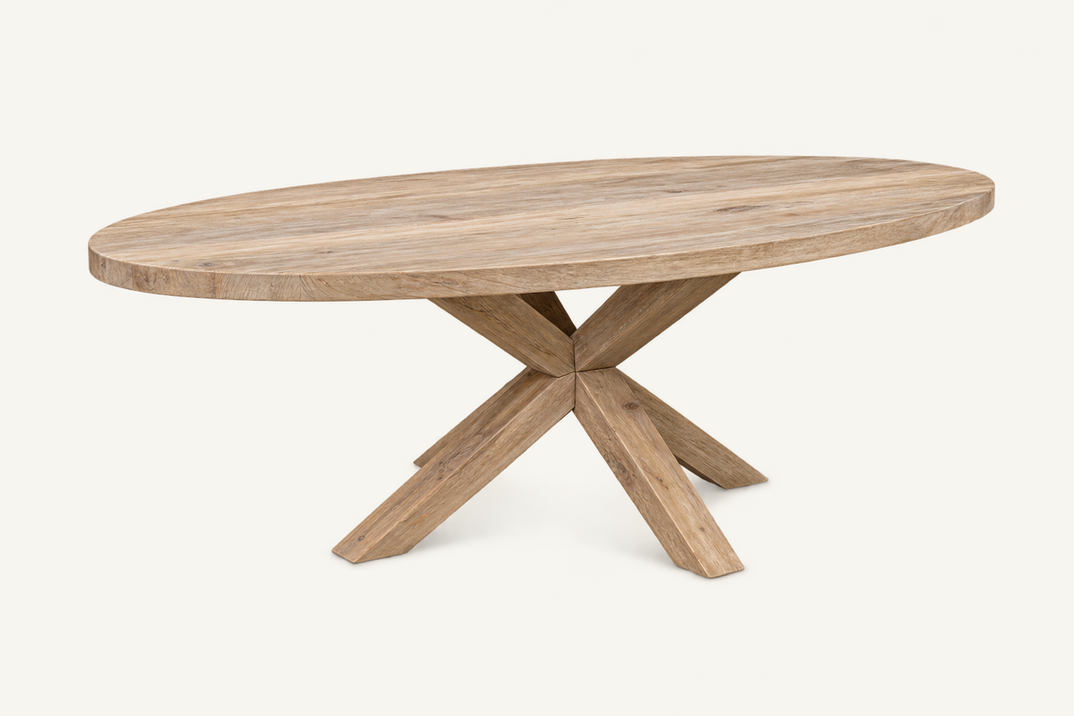 Oval Cross-Leg Dining Table in recycled teak, clean three-quarter catalog view