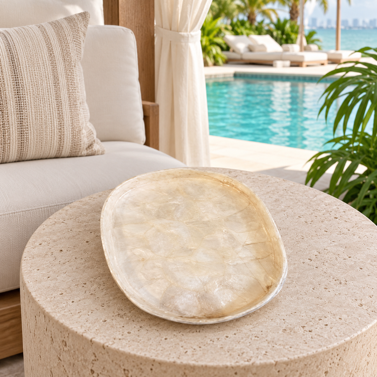 Ivory Capiz oval shell decorative tray in a luxury Miami poolside cabana
