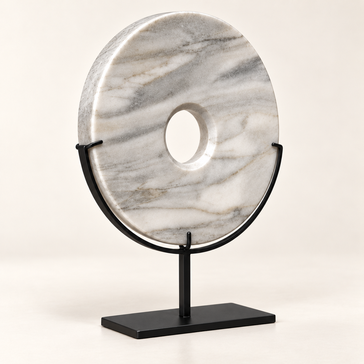 White natural stone disk showing natural veining