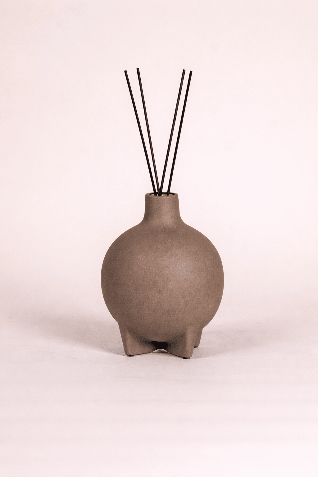 Close-up of Petra Reed Diffusers with stone-inspired vessel detail