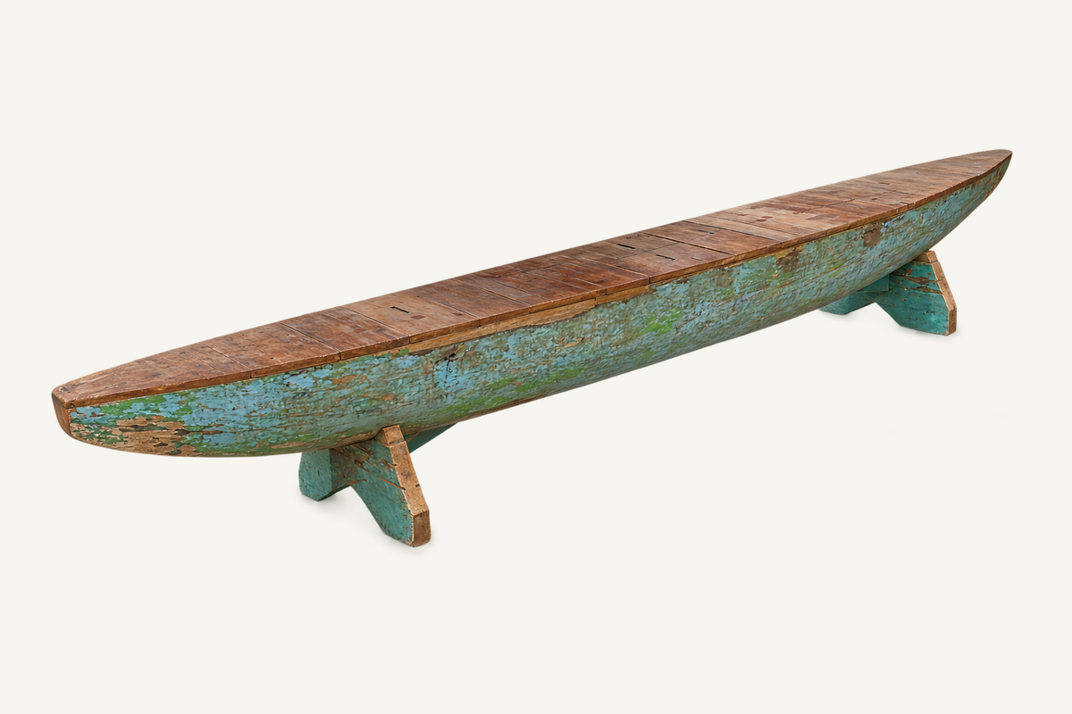 Recycled Canoe Bench: side view of long curved seat and painted canoe base