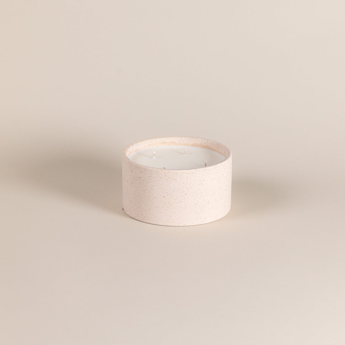 Scented bowl candles with warm sandy tone