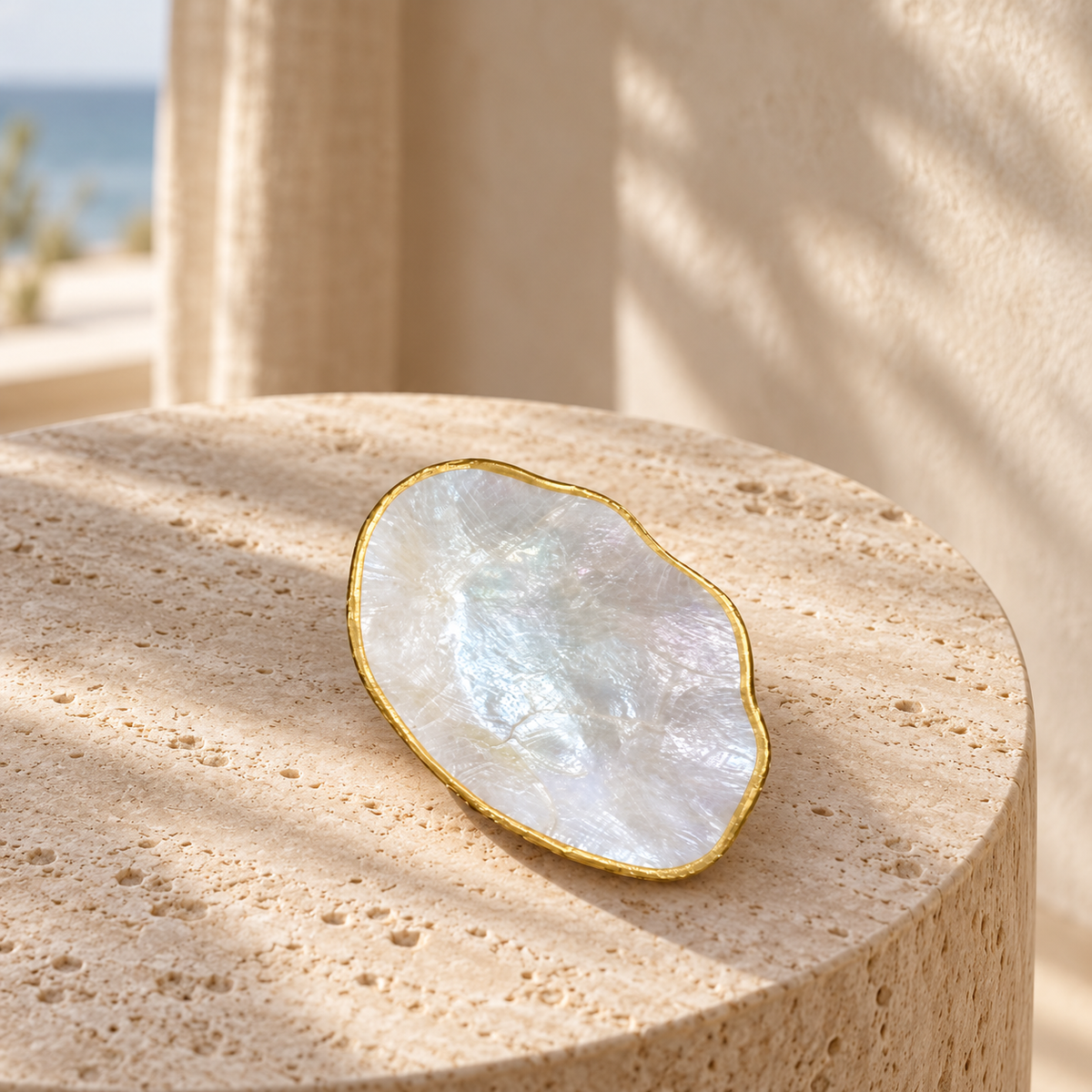 Small Organic Mother-of-Pearl Bowl styled on travertine