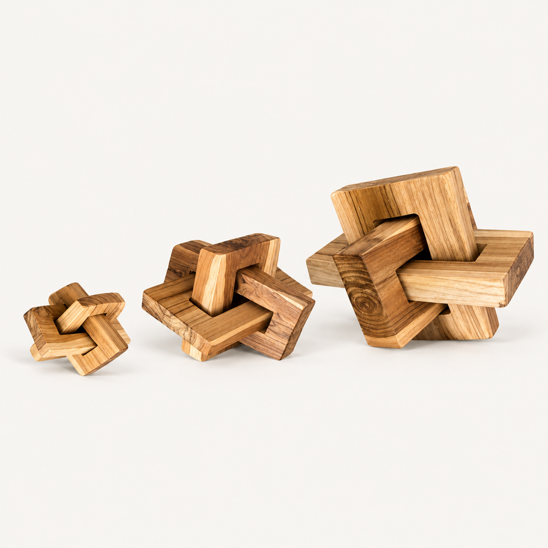 Square Teak Link Sculpture in three sizes on warm off-white background