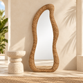 Tall Organic Rattan Floor Mirror styled in a warm neutral interior