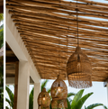 Premium teak branches installed as a luxury cabana ceiling in a tropical Miami-style space