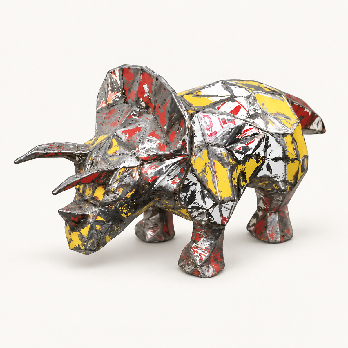 Recycled metal barrel Triceratops sculpture, front three-quarter view