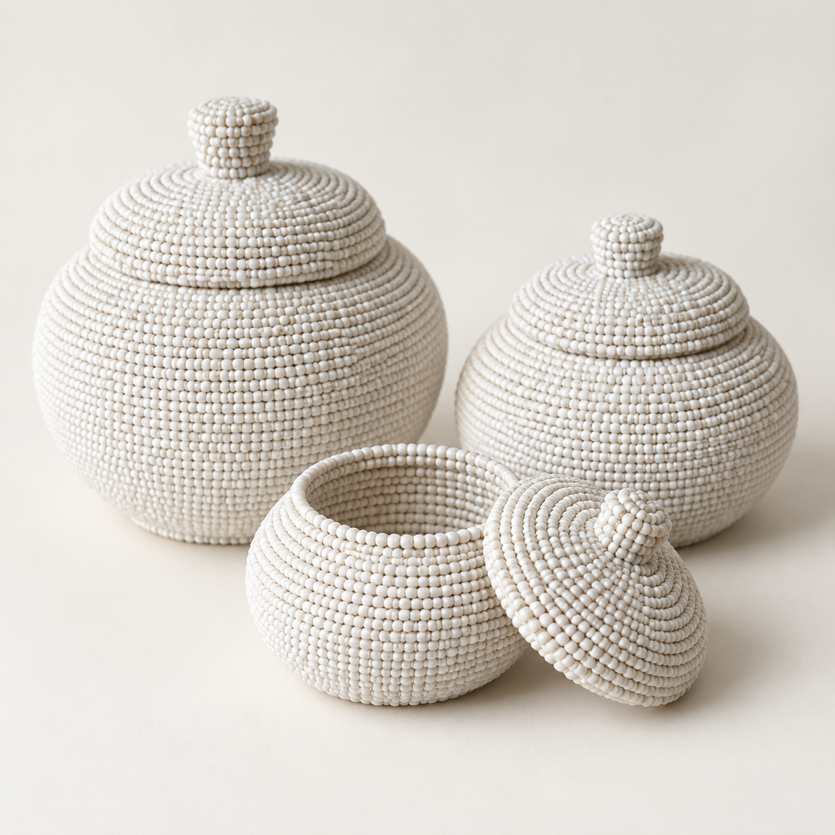 White hand-beaded lidded basket set — beadwork and lid detail