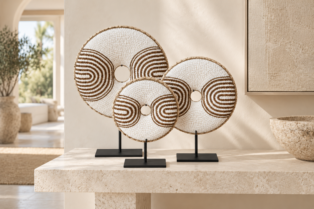 White Geometric shell donut sculptures styled on a console