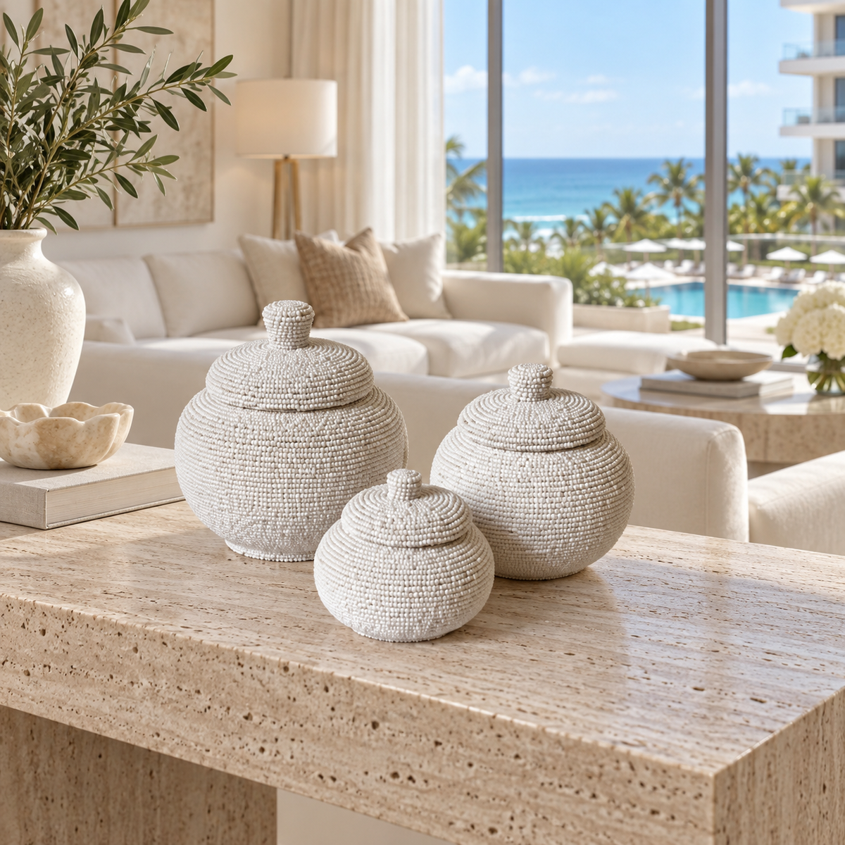White hand-beaded lidded baskets in a Miami hotel suite