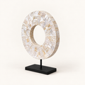 White Shell Disk on included black metal stand, angled view