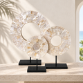 White Shell Disk sculptures styled in a refined Miami interior