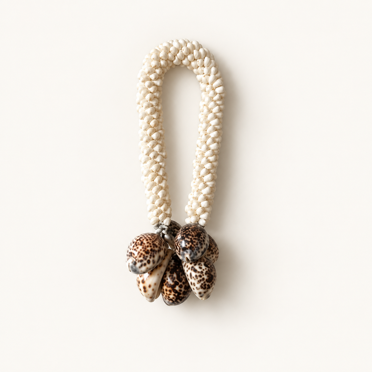 White Shell Loop Necklace on Metal Stand, front catalog view